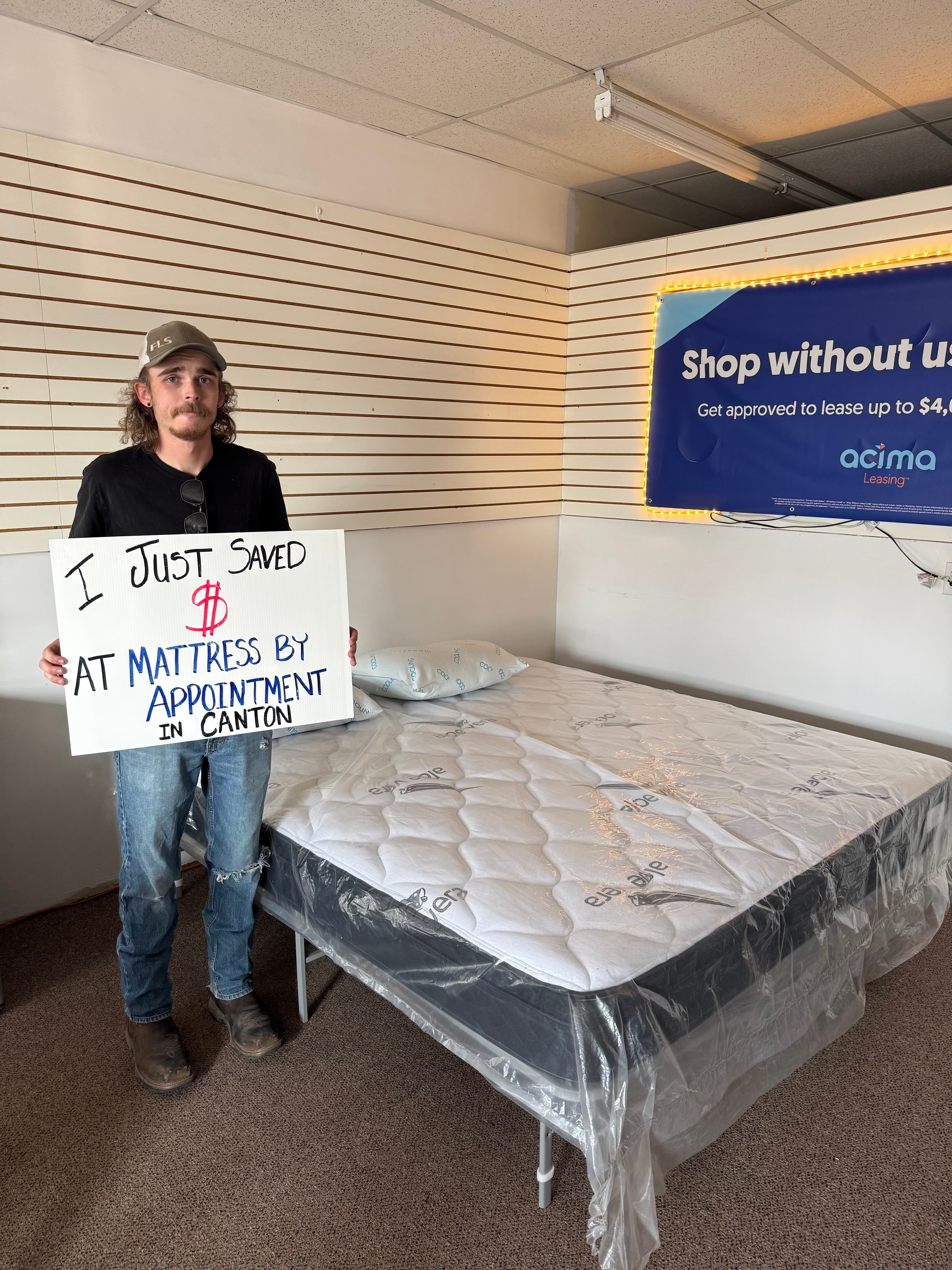 Happy customer with a new mattress from Mattress by Appointment Canton