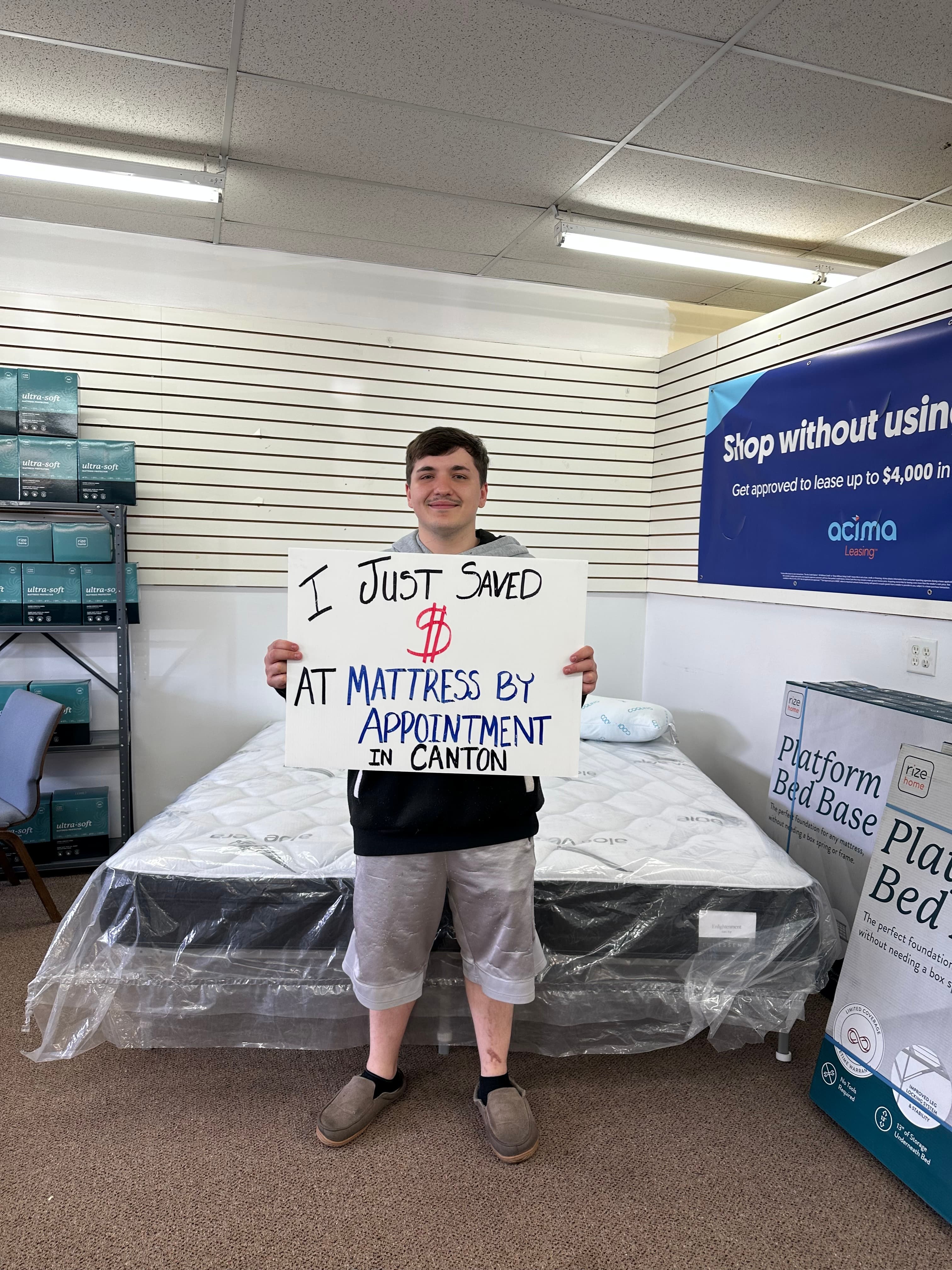 Happy customer with a new mattress from Mattress by Appointment Canton