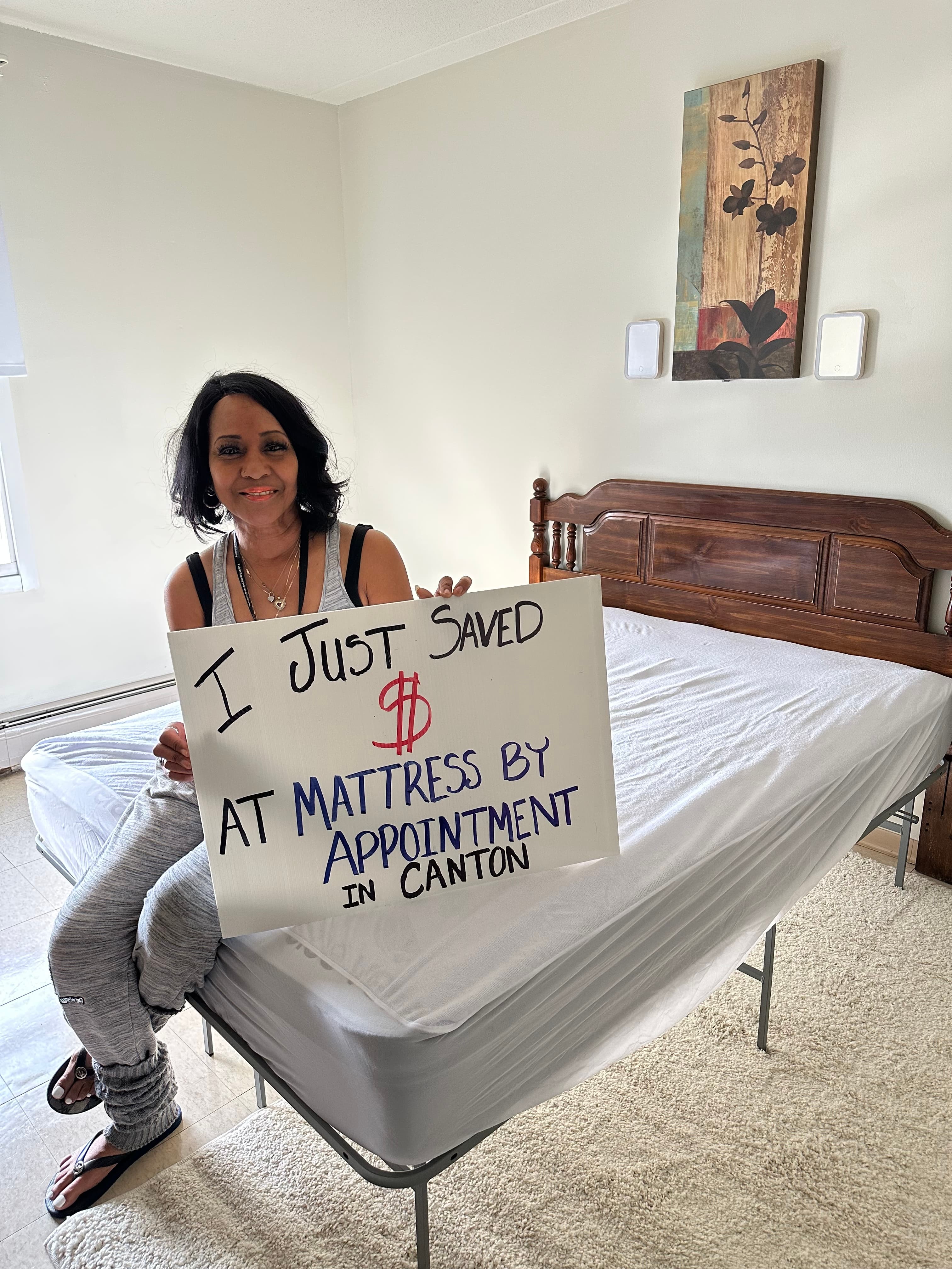 Happy customer with a new mattress from Mattress by Appointment Canton