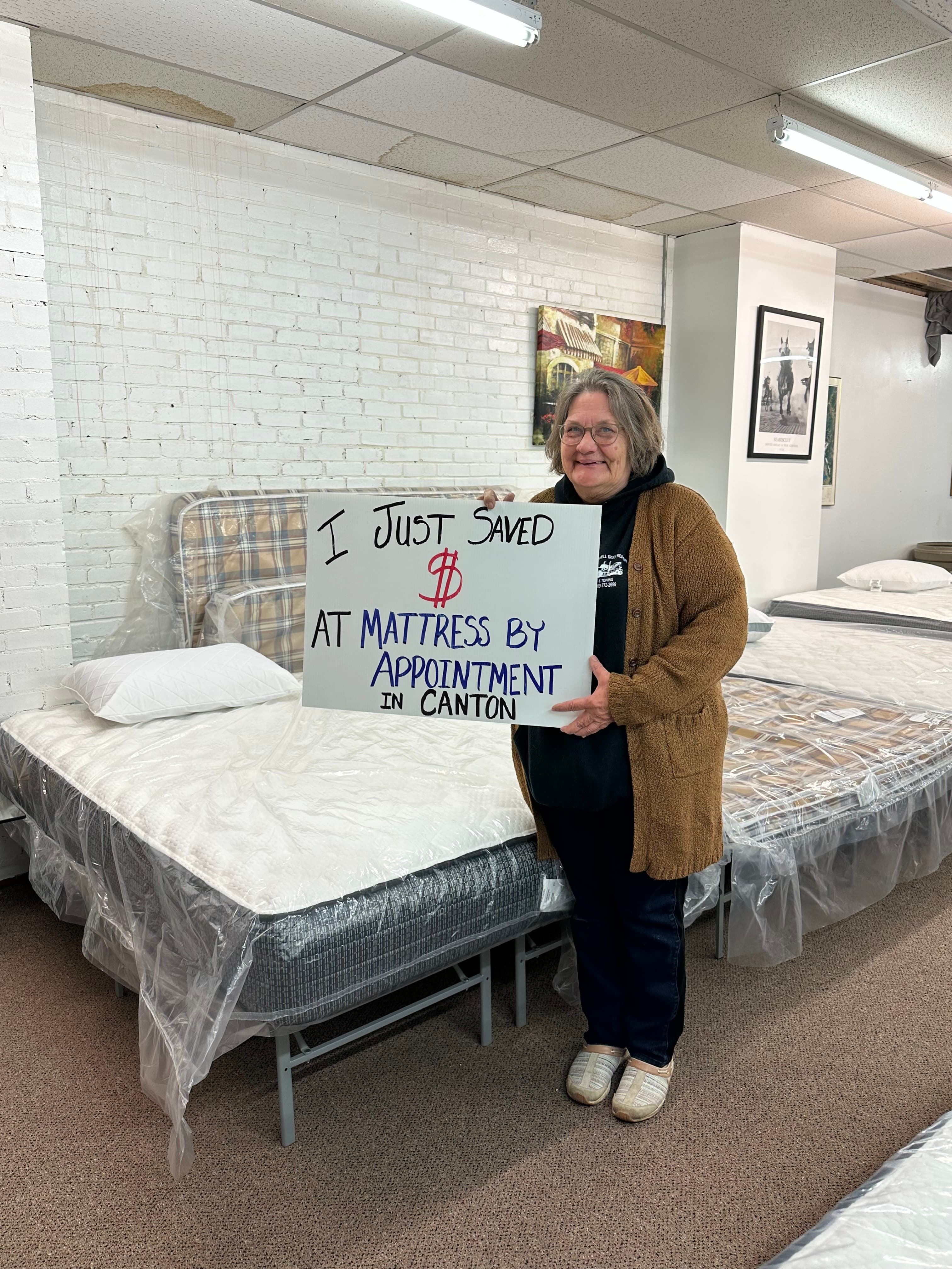 Happy customer with a new mattress from Mattress by Appointment Canton