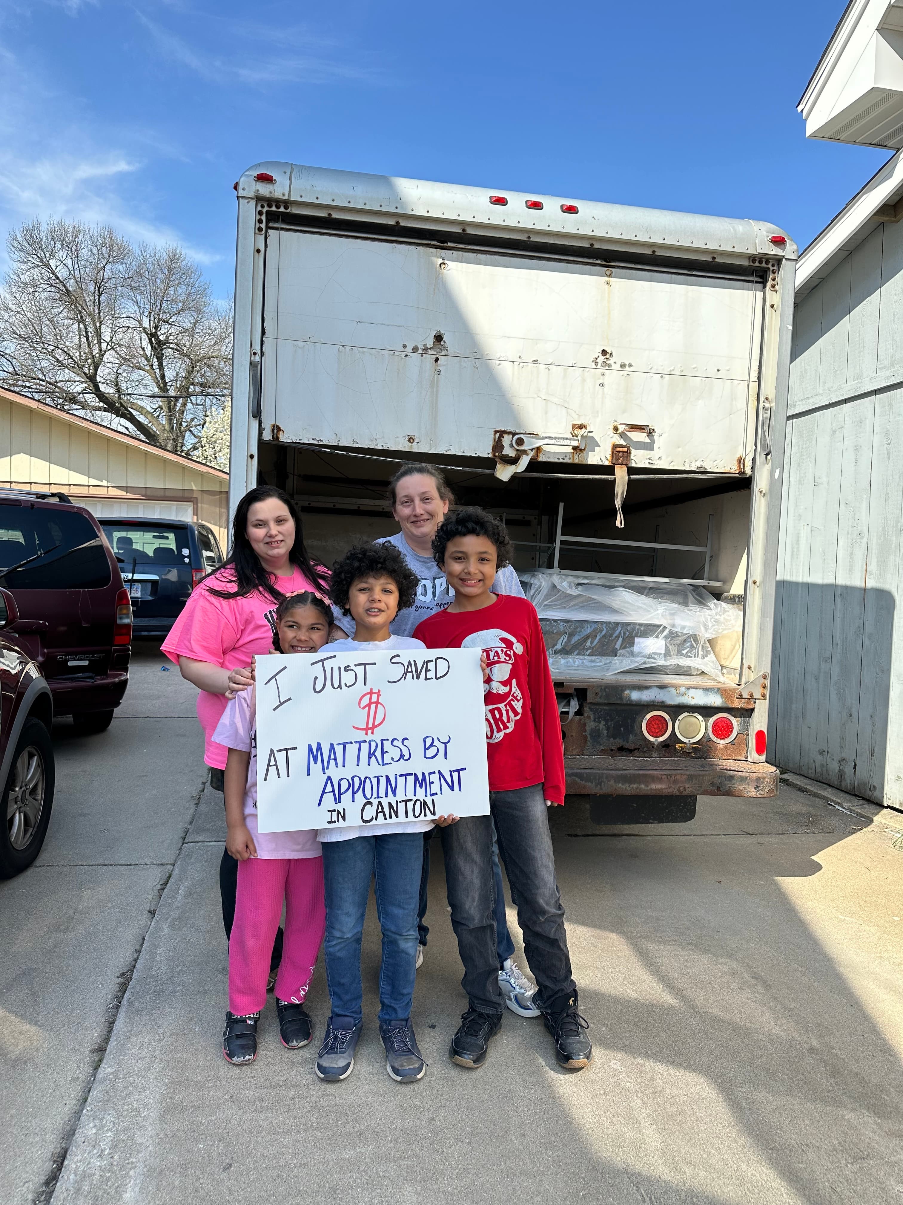 Happy customer with a new mattress from Mattress by Appointment Canton